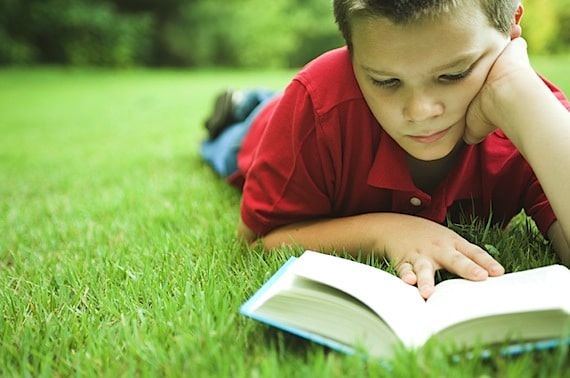 A Young Boy Reading Outside - Photo courtesy of ©iStockphoto.com/NickS, Image #2013115