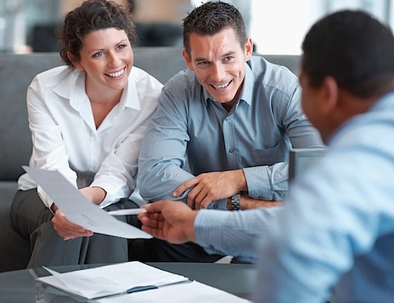 A Financial Advisor Helping a Couple with Their Financial Planning - Photo courtesy of ©iStockphoto.com/Yuri_Arcurs, Image #12401349