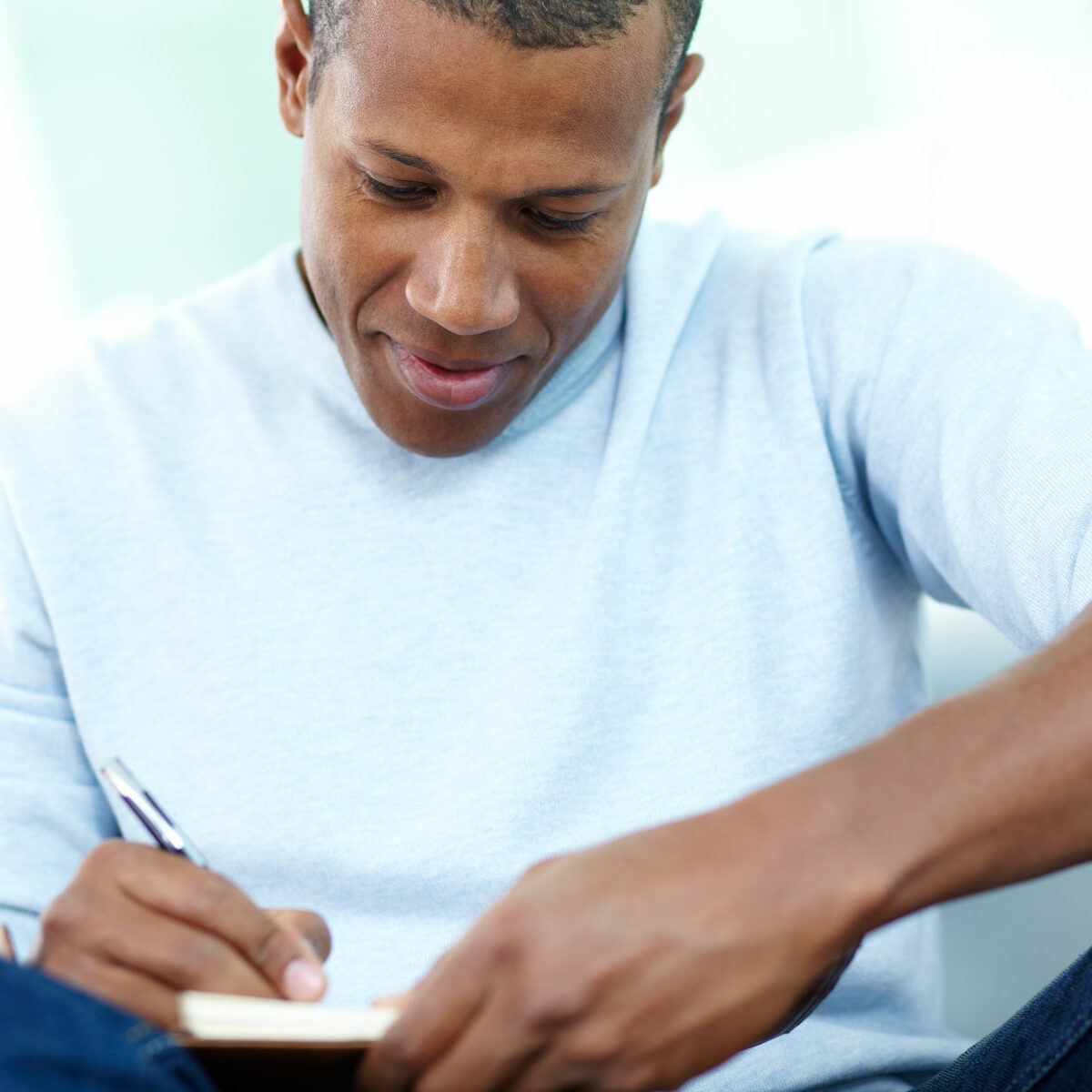 Man writing in journal
