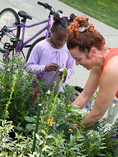Megan Hyatt Miller with her daughter in the garden